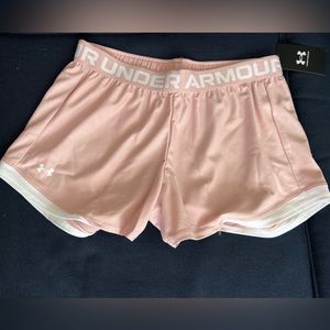 Retro pink and white Under Armour woman’s play up 2.0 shorts.